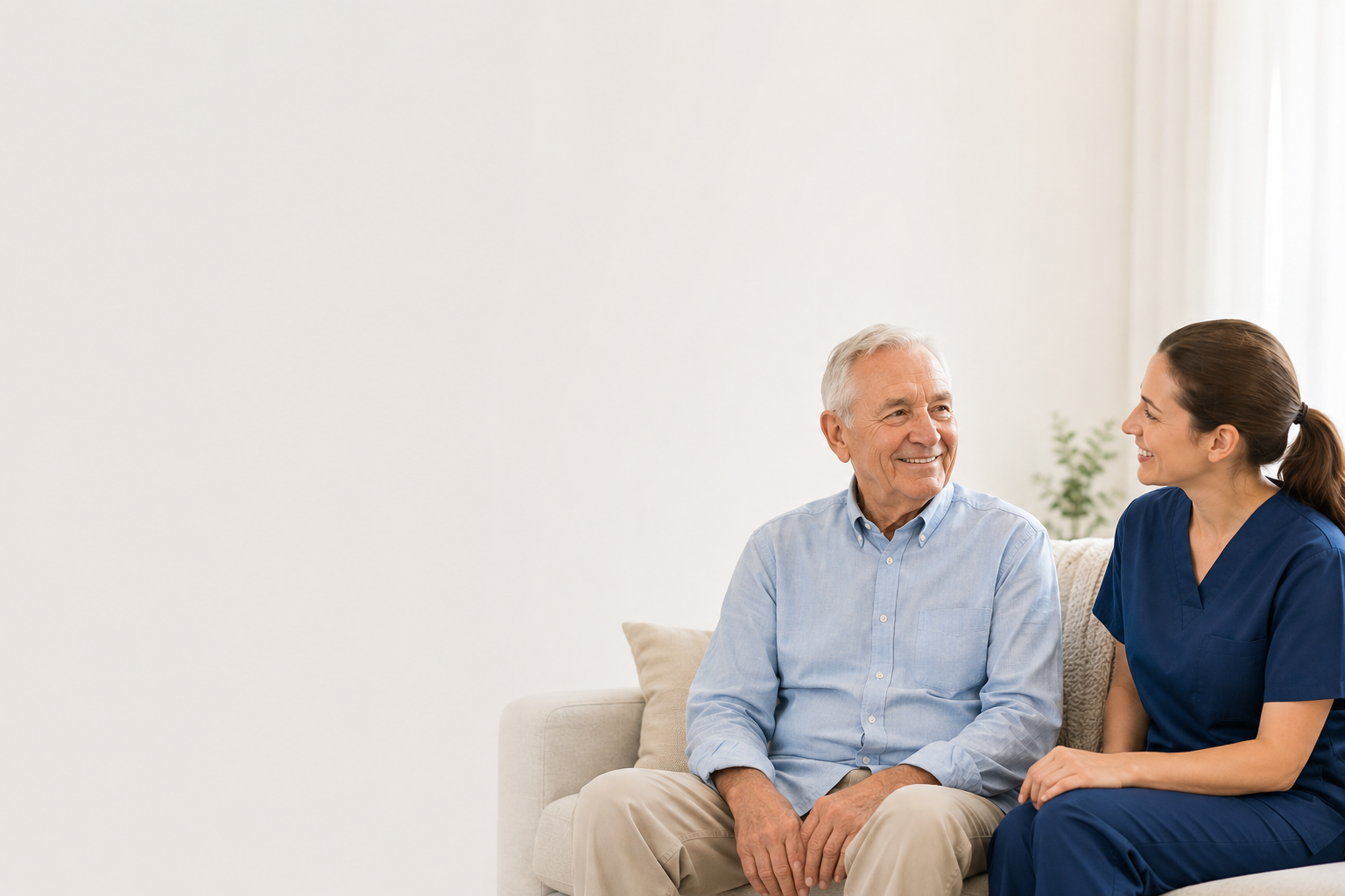 Caregiver laughing with a senior woman at home in Philadelphia